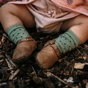 baby wearing green crew socks merino wool nz