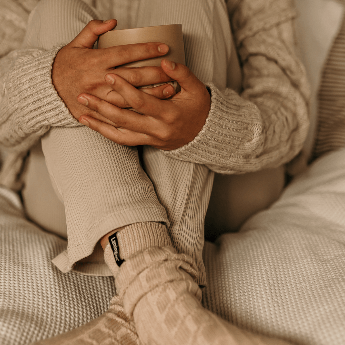 woman wearing merino wool luxury cable knit socks nz