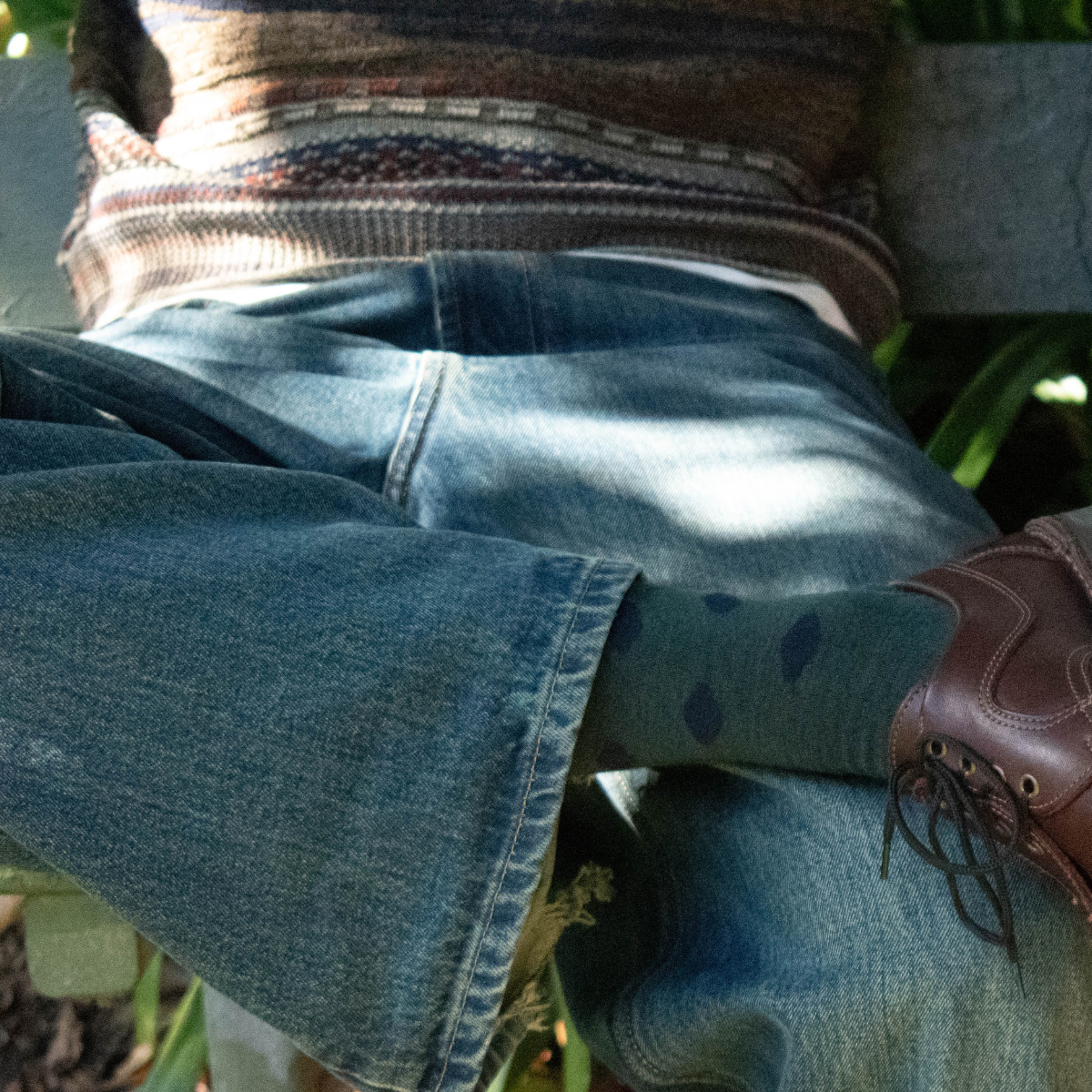man wearing merino wool crew socks green with blue spots nz